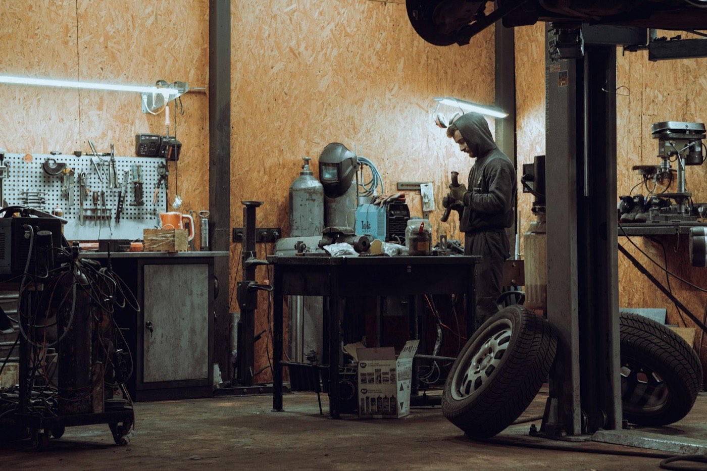 ASE-certified technician working on a vehicle in the Redstone Auto Care garage